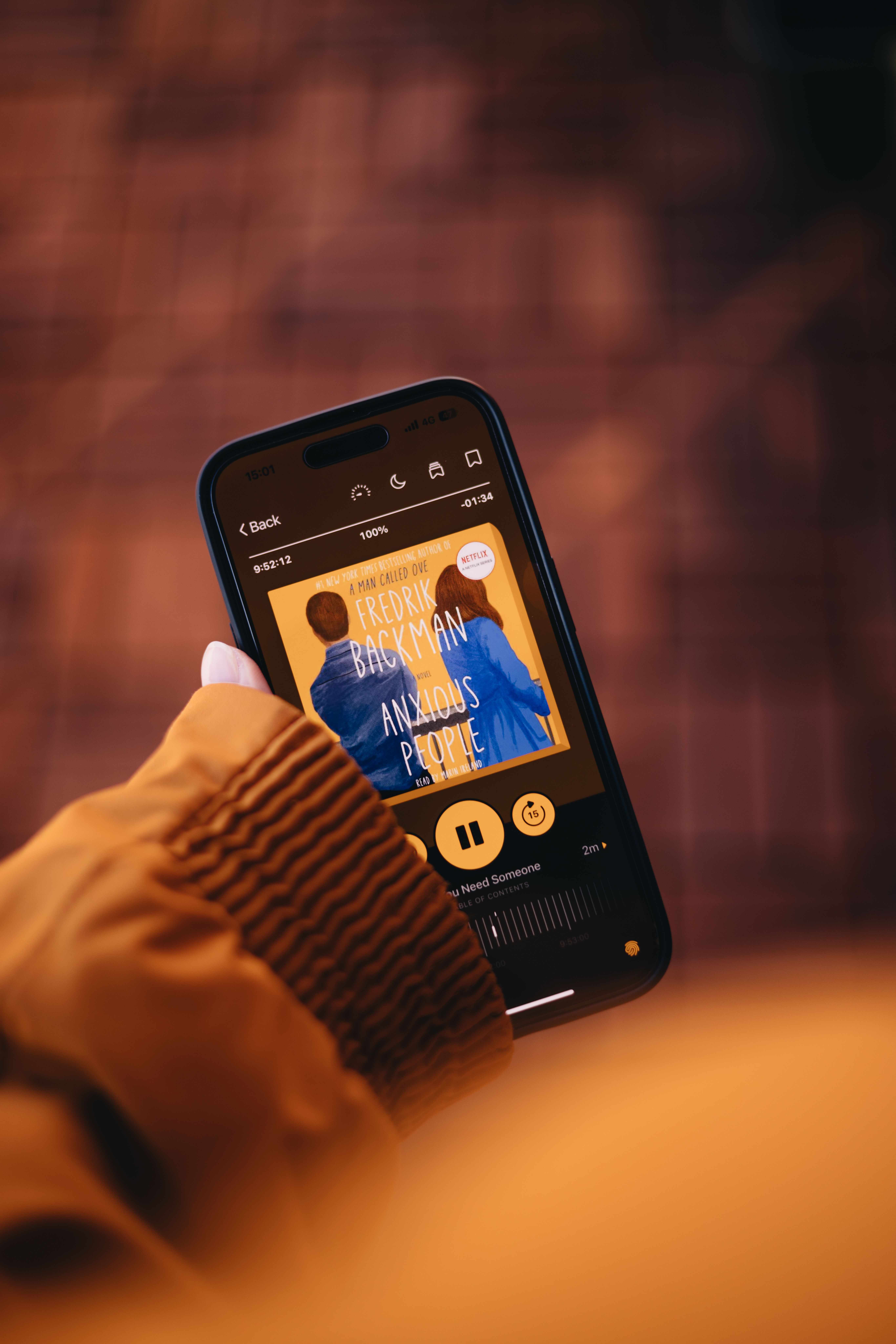 Person listening to audiobook on the go